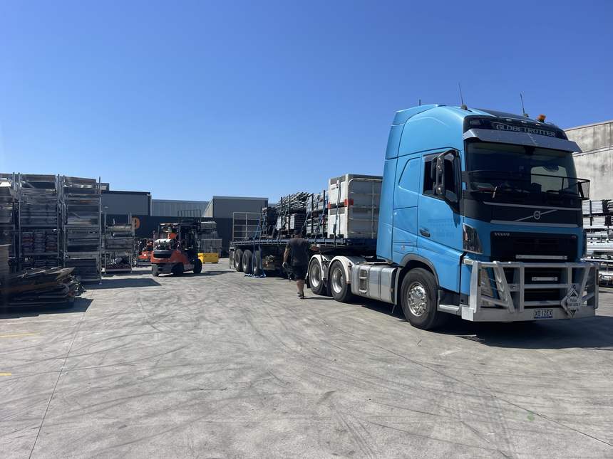 Freight being loaded onto a Quickcargo trailer by forklift
