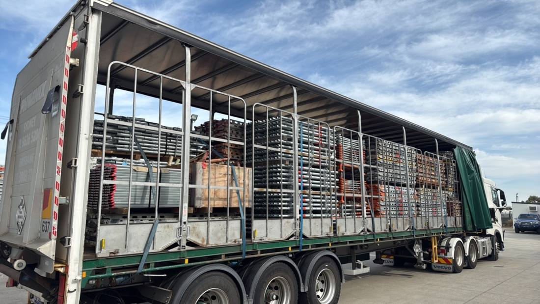Fully loaded flat-top trailer on a Quickcargo full truckload run